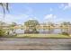 Scenic view of a lake with lush greenery and homes at 28 Lake Fairgreen Cir, New Smyrna Beach, FL 32168