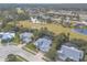 Aerial view of upscale neighborhood near golf course and lake at 2817 Bay Side Dr, New Smyrna Beach, FL 32168