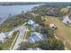 Aerial perspective of houses near golf course and calm water at 2817 Bay Side Dr, New Smyrna Beach, FL 32168