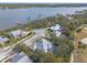 Drone view showcasing a waterfront home community near golf course at 2817 Bay Side Dr, New Smyrna Beach, FL 32168