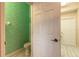 Powder room with green wave patterned wallpaper at 2817 Bay Side Dr, New Smyrna Beach, FL 32168