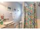 Small bathroom with shower, toilet, and granite vanity at 2817 Bay Side Dr, New Smyrna Beach, FL 32168