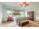 Primary bedroom with king bed and wood armoire at 2817 Bay Side Dr, New Smyrna Beach, FL 32168