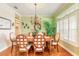 Elegant dining room with hardwood floors and large windows at 2817 Bay Side Dr, New Smyrna Beach, FL 32168