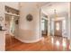 Light and airy entryway with hardwood floors and a view into the living areas at 2817 Bay Side Dr, New Smyrna Beach, FL 32168