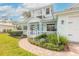 House exterior showcasing a welcoming front porch and landscaped walkway at 2817 Bay Side Dr, New Smyrna Beach, FL 32168