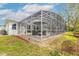 House exterior with a screened pool enclosure at 2817 Bay Side Dr, New Smyrna Beach, FL 32168