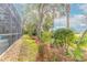 Landscaped backyard with mature trees and manicured lawn at 2817 Bay Side Dr, New Smyrna Beach, FL 32168