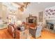 Relaxing living room with hardwood floors, fireplace, and wicker furniture at 2817 Bay Side Dr, New Smyrna Beach, FL 32168