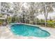 Inviting screened pool and spa with ample deck space for lounging at 2817 Bay Side Dr, New Smyrna Beach, FL 32168