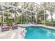 Inviting pool and spa with plenty of lounge space at 2817 Bay Side Dr, New Smyrna Beach, FL 32168