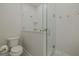 Clean bathroom with a toilet and a glass-enclosed shower at 2870 Isles Way, New Smyrna Beach, FL 32168