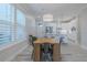 Dining area with wooden table and chairs, white kitchen in background at 2870 Isles Way, New Smyrna Beach, FL 32168