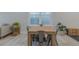 Light-filled dining area with a wood table and metal chairs at 2870 Isles Way, New Smyrna Beach, FL 32168