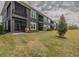 Exterior view of building with balconies and landscaping at 2870 Isles Way, New Smyrna Beach, FL 32168