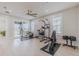 Bright home gym with various exercise equipment and plenty of space at 2870 Isles Way, New Smyrna Beach, FL 32168