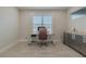 Modern home office features a large window and ample desk space at 2870 Isles Way, New Smyrna Beach, FL 32168