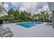 Community pool area with surrounding lounge chairs at 2870 Isles Way, New Smyrna Beach, FL 32168