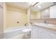 Clean bathroom with a bathtub, toilet and vanity at 2947 S Atlantic Ave # 1105, Daytona Beach Shores, FL 32118