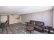 Spacious living room with a comfortable couch and wood-look floors at 2947 S Atlantic Ave # 1105, Daytona Beach Shores, FL 32118