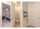 Small powder room with toilet and sink at 3014 Borassus Dr, New Smyrna Beach, FL 32168