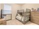 Bedroom with a bunk bed, dresser, and a TV at 3014 Borassus Dr, New Smyrna Beach, FL 32168