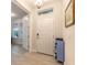 Light and airy entryway with a storage cabinet at 3014 Borassus Dr, New Smyrna Beach, FL 32168