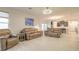 Spacious living room featuring neutral colored couches and tile flooring at 3014 Borassus Dr, New Smyrna Beach, FL 32168