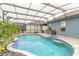 Enjoy this refreshing pool and spa with a screened enclosure at 3014 Borassus Dr, New Smyrna Beach, FL 32168