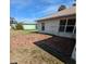 Circular brick patio in the backyard of a single-story house at 3020 Kumquat Dr, Edgewater, FL 32141