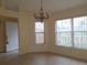 Bright dining area with a chandelier and large windows at 3020 Kumquat Dr, Edgewater, FL 32141