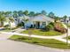 One story house and street view of neighborhood at 3037 Borassus Dr, New Smyrna Beach, FL 32168