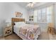 Bedroom with queen-size bed and bohemian decor at 3037 Borassus Dr, New Smyrna Beach, FL 32168