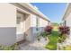 White front door with white shutters and landscaping at 3069 Isles Way, New Smyrna Beach, FL 32168