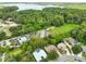 Aerial view showcasing a lakefront property and neighborhood at 3084 Heartleaf Pl, Winter Park, FL 32792