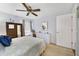 Bedroom with queen bed, built-in dresser and window at 3084 Heartleaf Pl, Winter Park, FL 32792