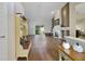 Bright entryway with hardwood floors and bench at 3084 Heartleaf Pl, Winter Park, FL 32792