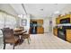 Kitchen with granite countertops, wood cabinets, and black appliances at 3084 Heartleaf Pl, Winter Park, FL 32792