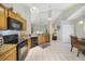 Kitchen with granite countertops and black appliances at 3084 Heartleaf Pl, Winter Park, FL 32792