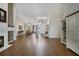 Spacious living room with hardwood floors, fireplace, and sliding glass doors leading to the backyard at 3084 Heartleaf Pl, Winter Park, FL 32792