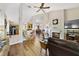 Spacious living room features a fireplace and hardwood floors at 3084 Heartleaf Pl, Winter Park, FL 32792