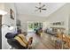 Living room with sliding doors leading to backyard at 3084 Heartleaf Pl, Winter Park, FL 32792