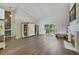 Living room with hardwood floors, fireplace and backyard access at 3084 Heartleaf Pl, Winter Park, FL 32792