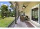 Spacious screened-in porch with seating area and view of backyard at 3084 Heartleaf Pl, Winter Park, FL 32792