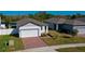 Two story home with two car garage and landscaped yard at 3191 Crab Trap Dr, New Smyrna Beach, FL 32168