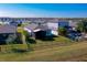 Aerial view of a home's backyard with a screened-in patio and inviting pool area at 3191 Crab Trap Dr, New Smyrna Beach, FL 32168