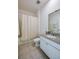 Clean bathroom with shower/tub combo and granite countertop at 3191 Crab Trap Dr, New Smyrna Beach, FL 32168