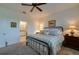 Spacious bedroom with king-size bed and ensuite bathroom access at 3191 Crab Trap Dr, New Smyrna Beach, FL 32168