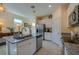 Kitchen island with granite countertop and stainless steel appliances at 3191 Crab Trap Dr, New Smyrna Beach, FL 32168