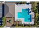 Aerial view of a community pool with ample seating and a nearby playground at 3191 Crab Trap Dr, New Smyrna Beach, FL 32168